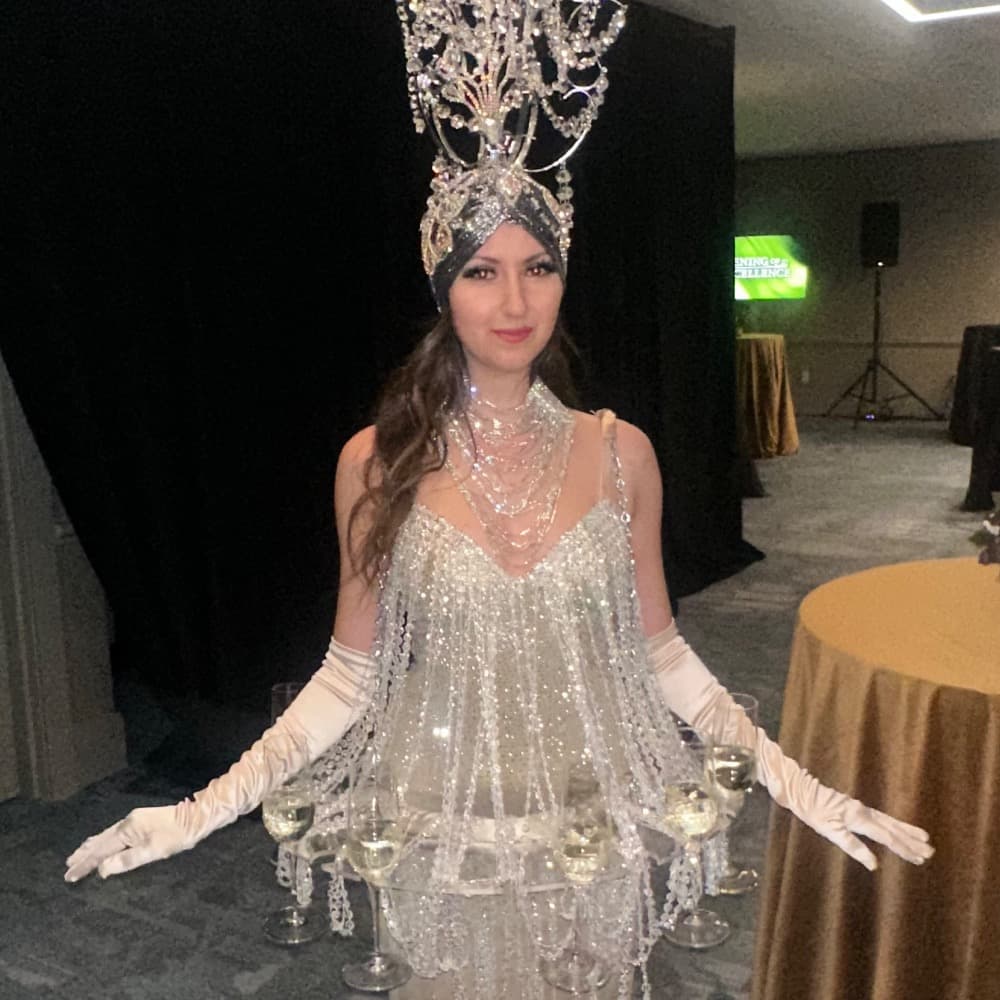 Living Chandelier Champagne Greeter Profile Picture